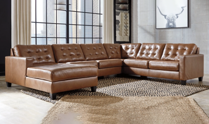 Baskove Leather Sectional In Auburn