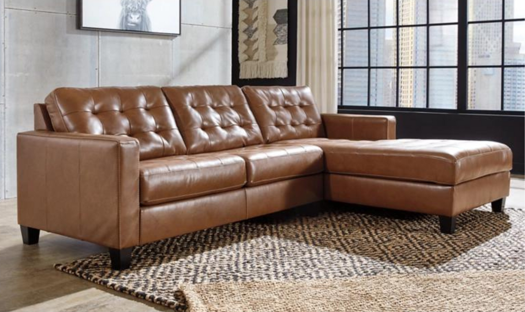 Baskove Leather Sectional In Auburn